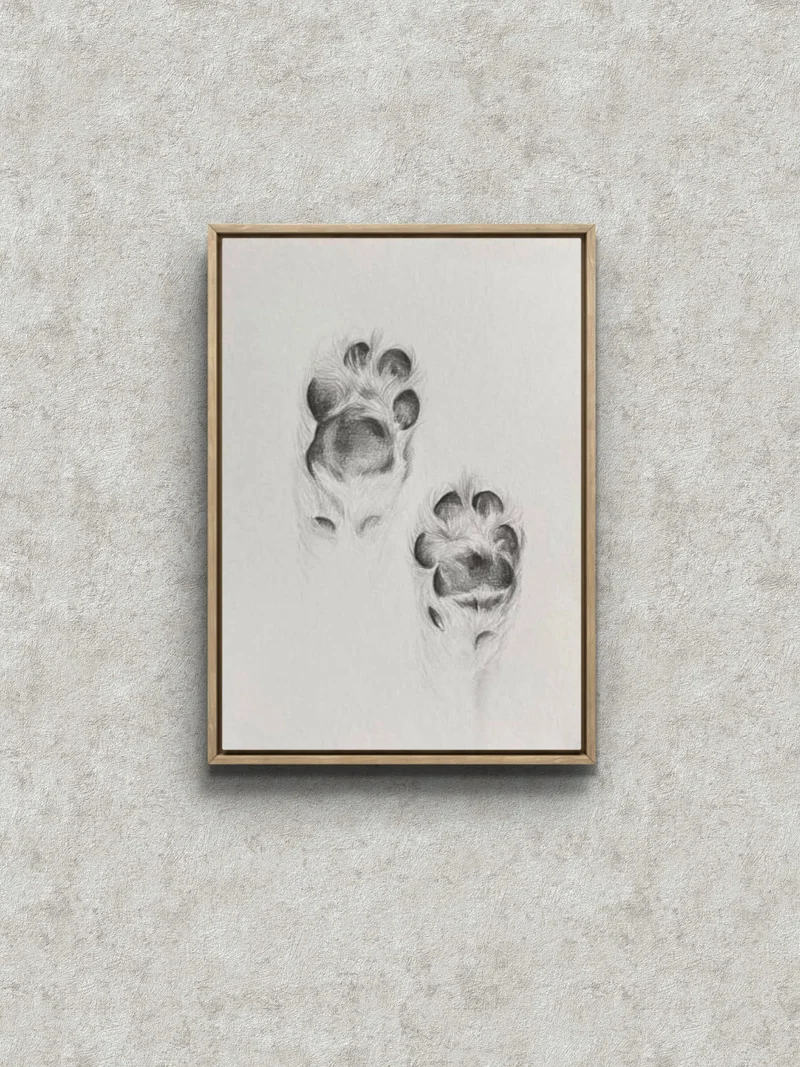 Graphite pencil drawing of two dog paw prints