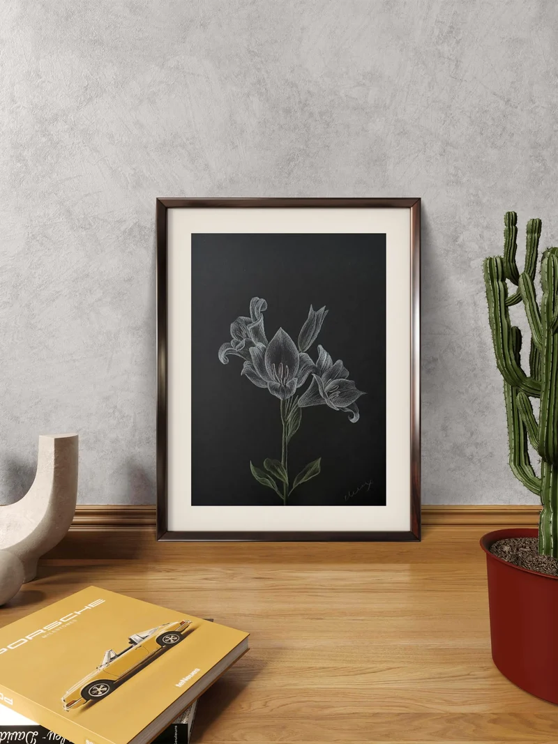 White pencil lily with green stem on black paper